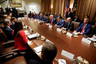President Donald Trump holds out his first cabinet seats of his second administration